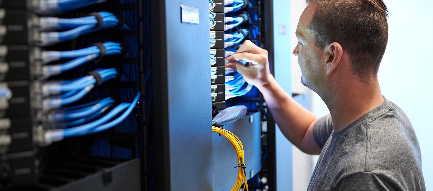 Employee doing maintenance on a server