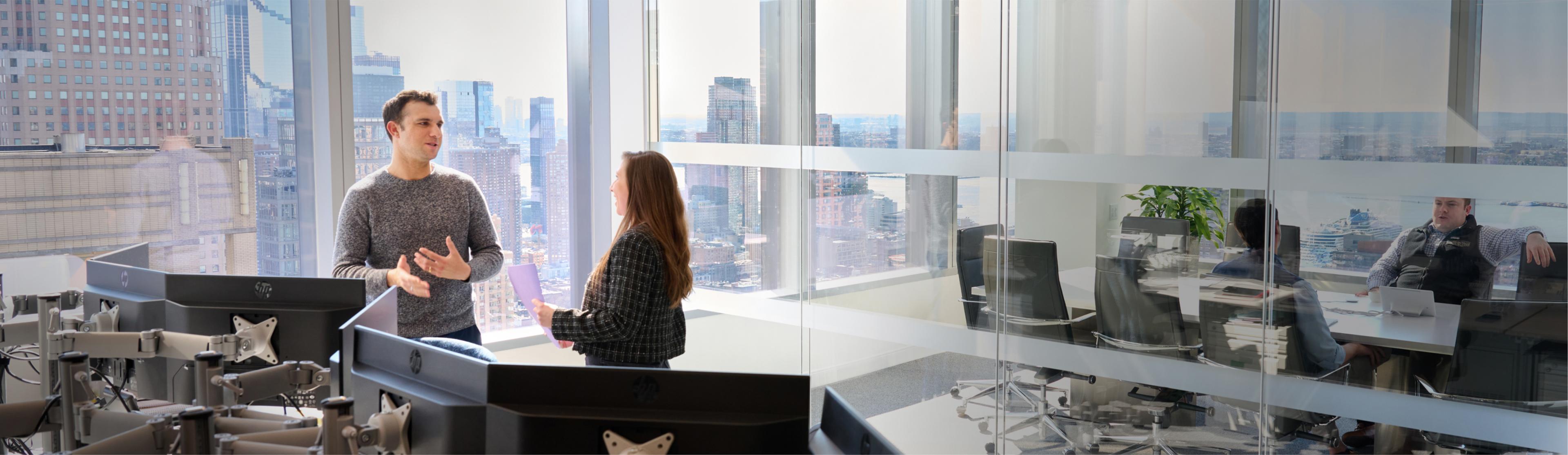 Employees having a meeting in an office room