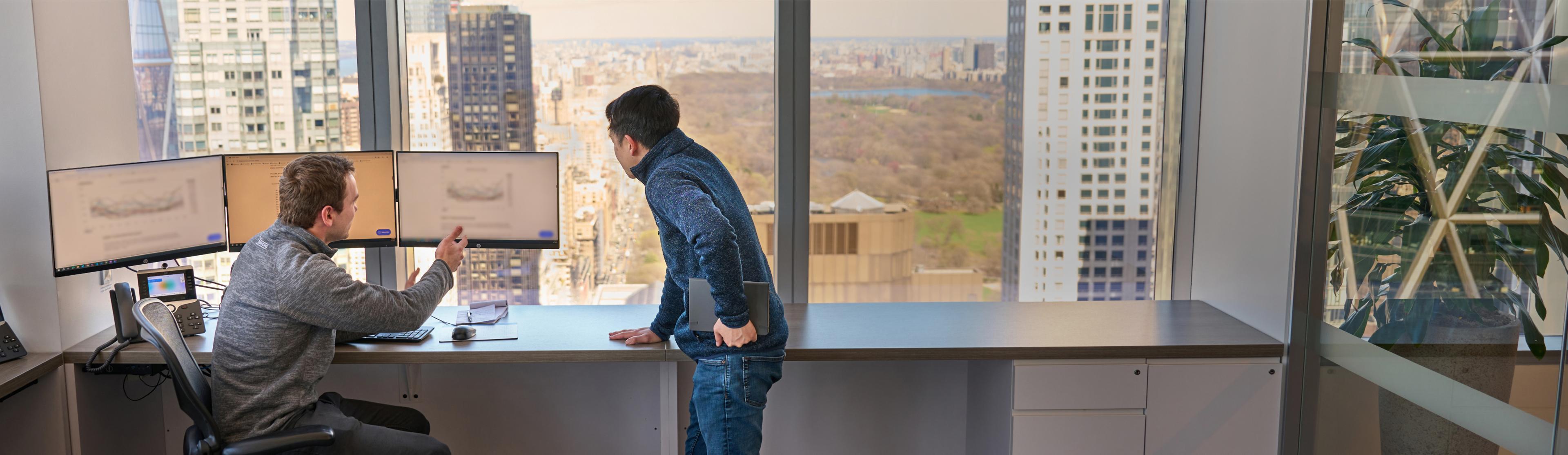 Employees having a meeting in an office room